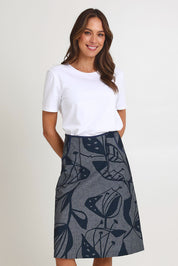 Model Madeline wearing size S of the Avril Long Cotton Skirt in colour Chambray (Grey), from the front, cropped image