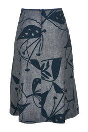 Product shot of the Avril Long Cotton Skirt in colour Chambray (Grey), from the back