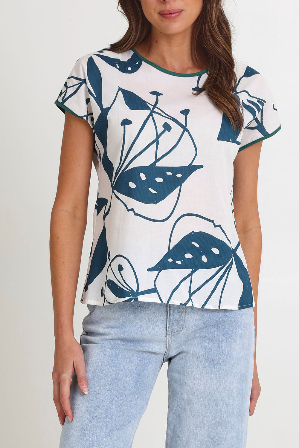 Model Madeline wearing size S of the Tilly Cotton Top in colour Articblue (Blue), from the front, cropped image