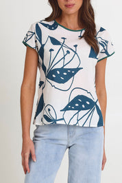 Model Madeline wearing size S of the Tilly Cotton Top in colour Articblue (Blue), from the front, cropped image