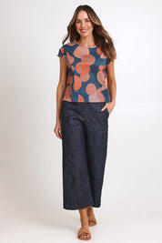 Model Madelinec wearing size 10 of the Thea Top - Smoke in colour Smoke, from the front