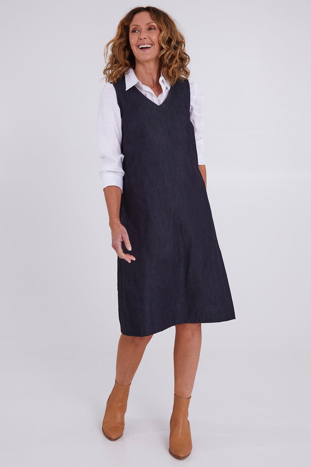 Model Emma wearing size S of the Susanne Denim Dress in colour Indigo (Blue), from the front, showing the whole outfit
