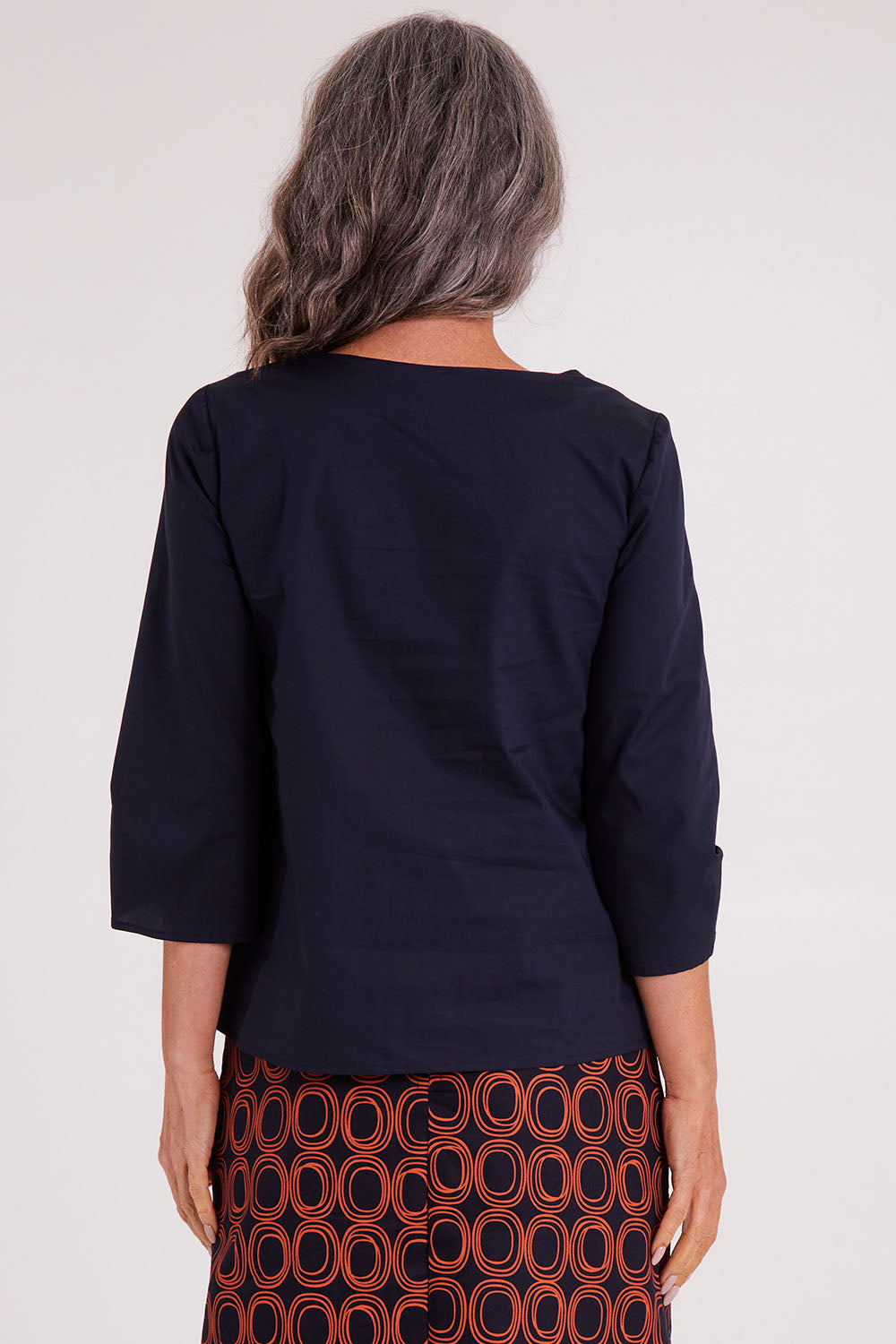 Model Luisa wearing size S of the Lori Top in colour Navy (Blue), from the back