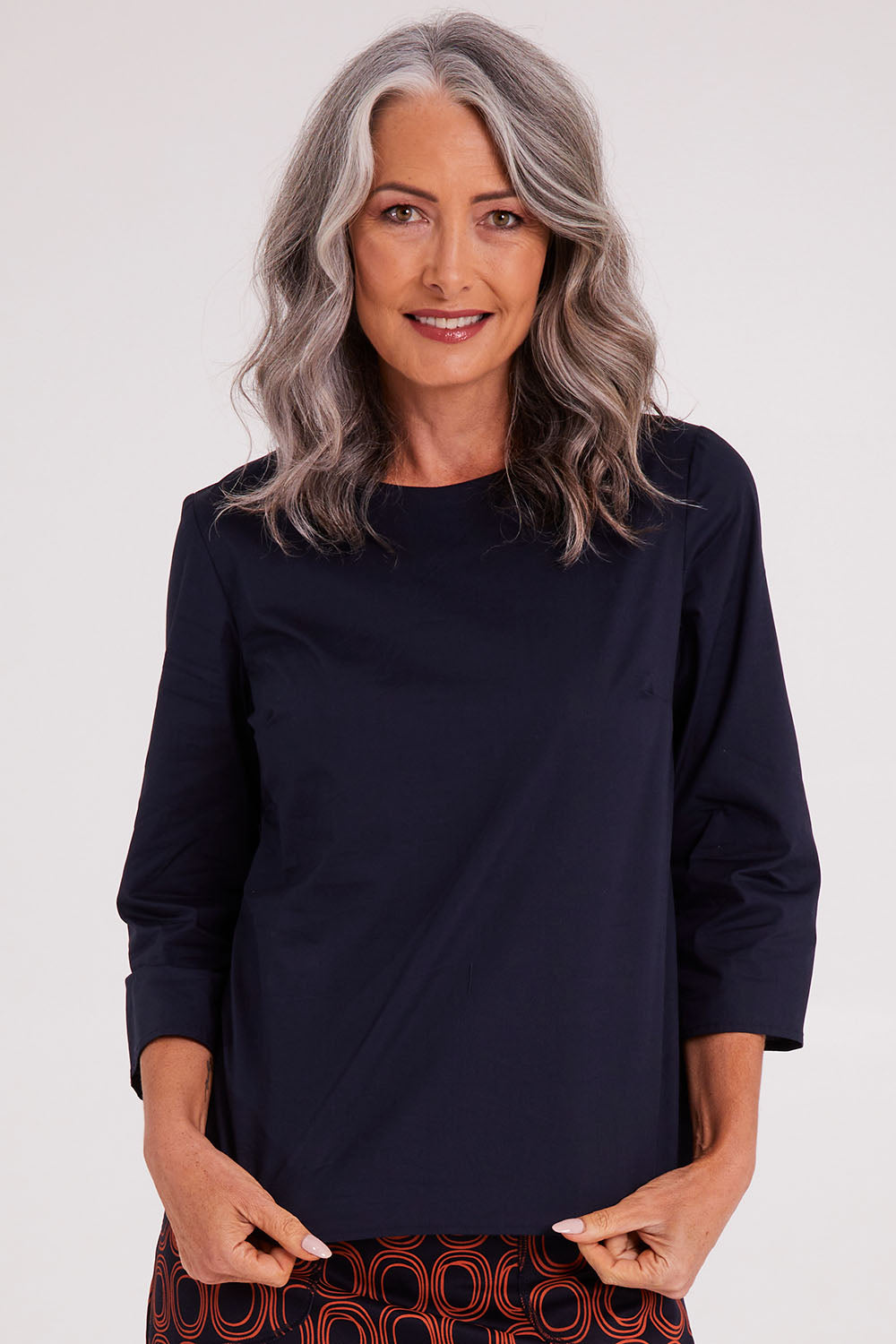Model Luisa wearing size S of the Lori Top in colour Navy (Blue), from the front, cropped image