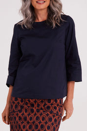 Model Luisa wearing size S of the Lori Top in colour Navy (Blue), from the front, cropped image