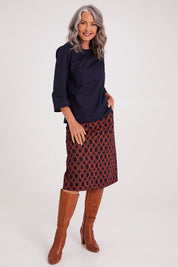 Model Luisa wearing size S of the Lori Top in colour Navy (Blue), from the front, showing the whole outfit
