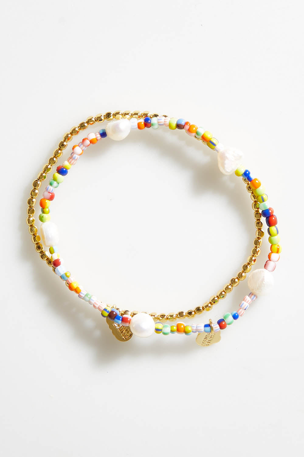 A model wearing size OneSize of the Gold & Multi Bracelet Set in colour Goldmulti (Metallics), from the front, showing the whole outfit