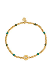 Product shot of the Enamel North Star Bead Bracelet in colour Goldgreen (Metallics), from the front