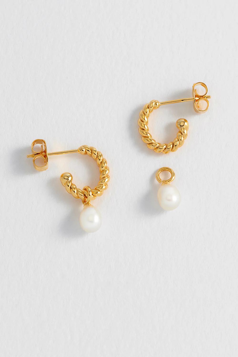 Product shot of the Pearl Drop And Twist Hoop Earrings in colour Goldpearl (Metallics), detail