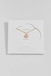 Product shot of the North Star Coin Necklace – Gold in colour Gold, from the front