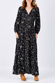 Model Helen wearing size S of the Luna Dress in colour MarbleBlac (Black), from the front, cropped image