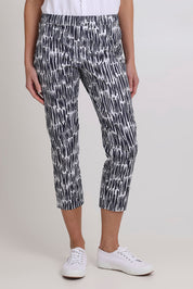 Model Madeline wearing size 10 of the Fuss Free Cotton Blend Taper Capri Trapeze Pant in colour Code (Black), from the front, cropped image