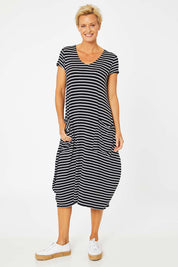 Model Amelia wearing size S of the Pocket Rocket Dress in colour Navwhistri (Blue), from the front, showing the whole outfit