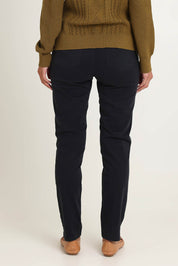 Model Riina wearing size 10 of the Holey Moleskin Trouser in colour Indigo (Blue), from the back