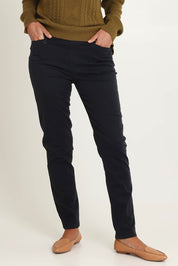 Model Riina wearing size 10 of the Holey Moleskin Trouser in colour Indigo (Blue), from the front, cropped image