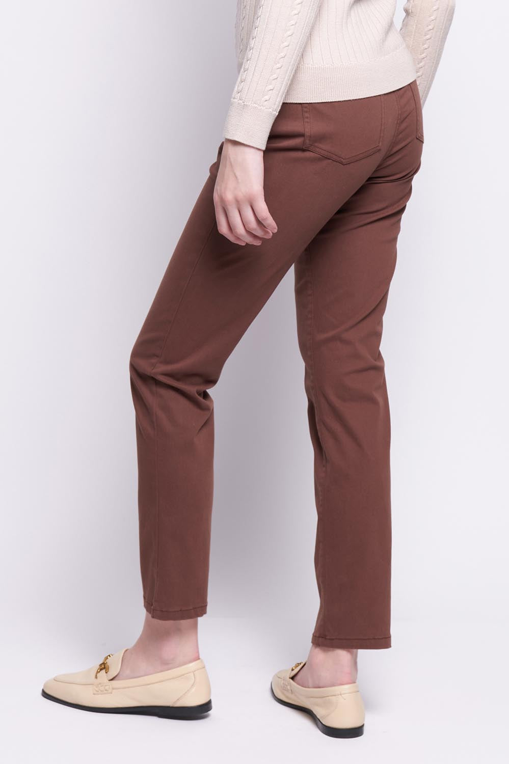 A model wearing the Holey Moleskin Trouser in colour Sepia, from the back