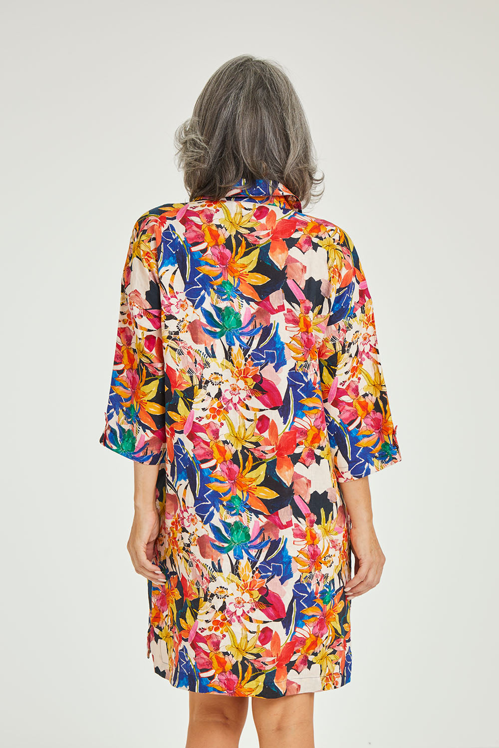 Model Luisa wearing size 10 of the Natural Abilities Linen Dress in colour Chelsea (Blue), from the back