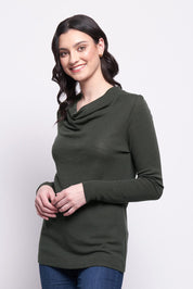 A model wearing the Holy Cowl Wool Top in colour Moss (Green), from the front, cropped image