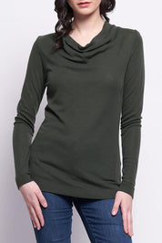 A model wearing the Holy Cowl Wool Top in colour Moss (Green), from the front, cropped image