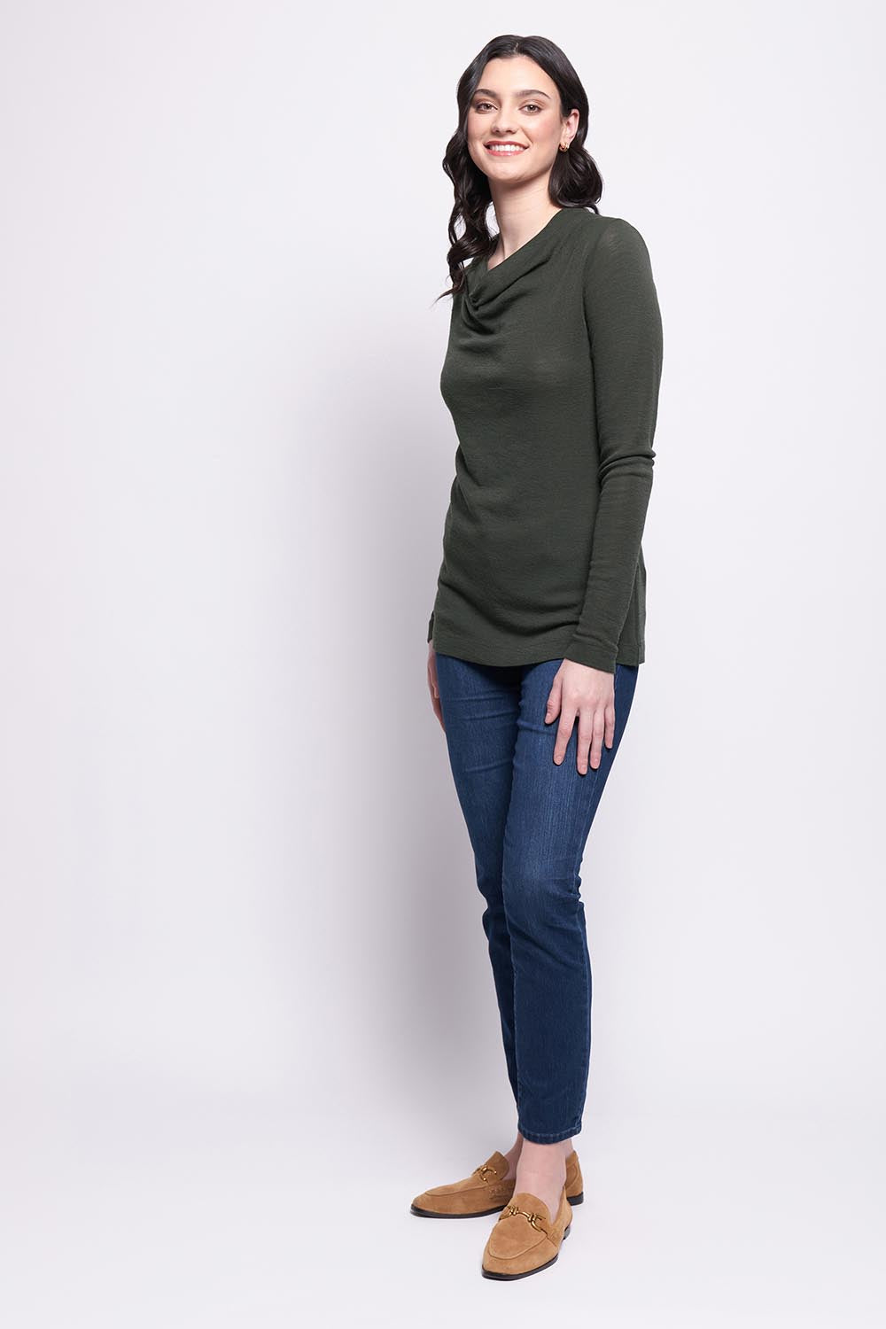 A model wearing the Holy Cowl Wool Top in colour Moss (Green), from the front, showing the whole outfit