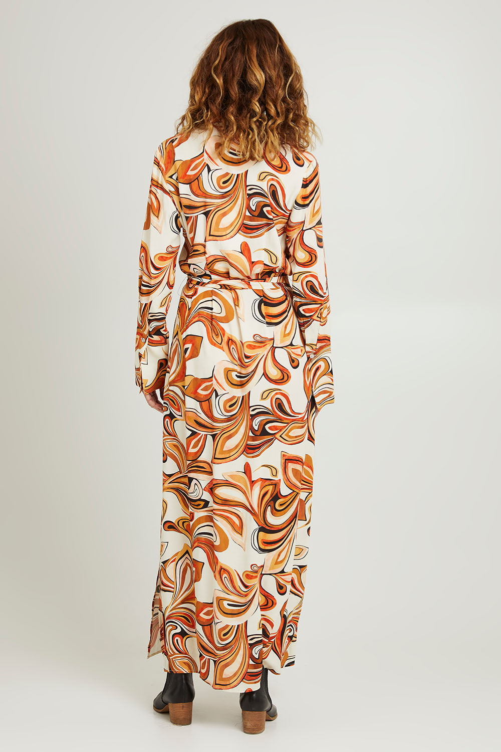 Model Emma wearing size 10 of the Centre Stage Dress in colour Boho, from the back