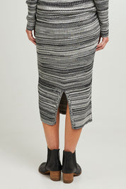 Model Emma wearing size S of the Space Jam Skirt in colour Blkivory (Black), from the back