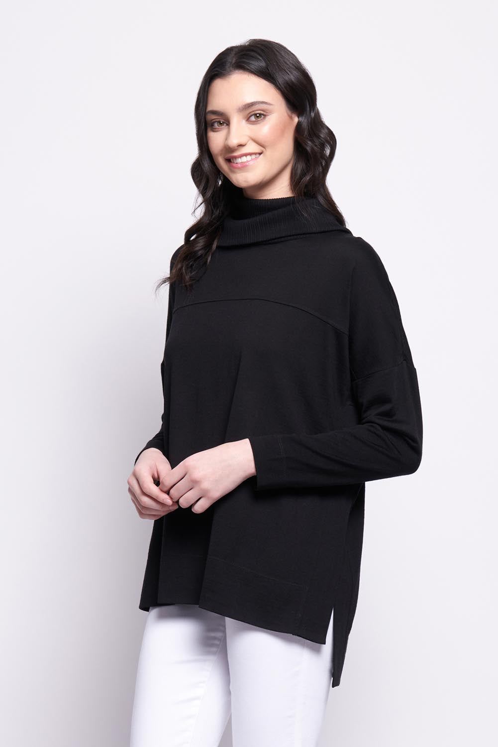A model wearing the Merino Love Your Moves Sweater in colour Black (Black), from the front, cropped image