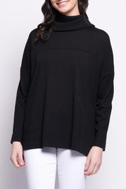 A model wearing the Merino Love Your Moves Sweater in colour Black (Black), from the front, cropped image