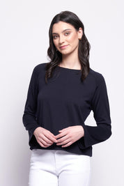 A model wearing the Merino Belong Together Sweater in colour Futuredusk (Blue), from the front, cropped image