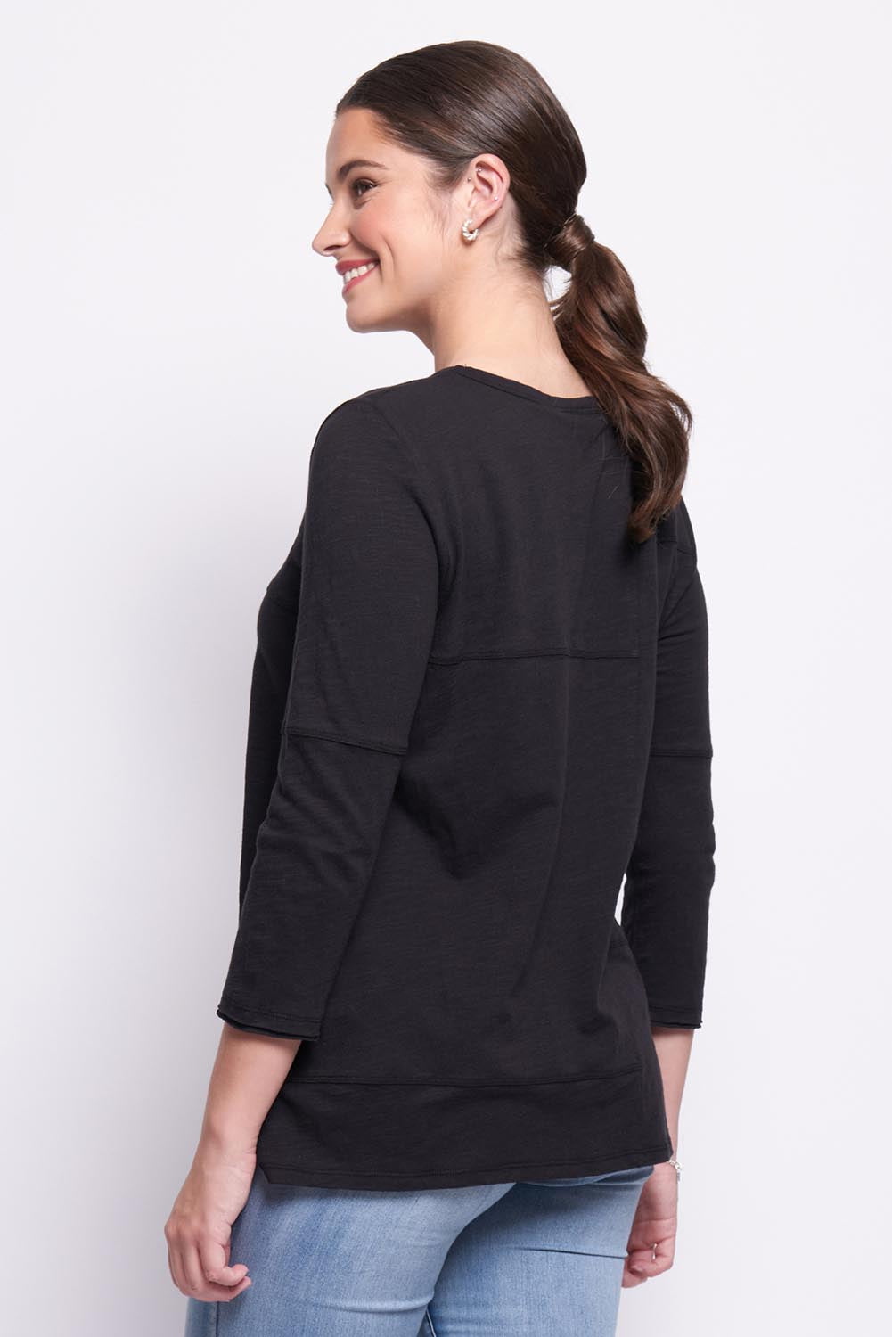 A model wearing the Sew It Seams Cotton Top in colour Black (Black), from the back