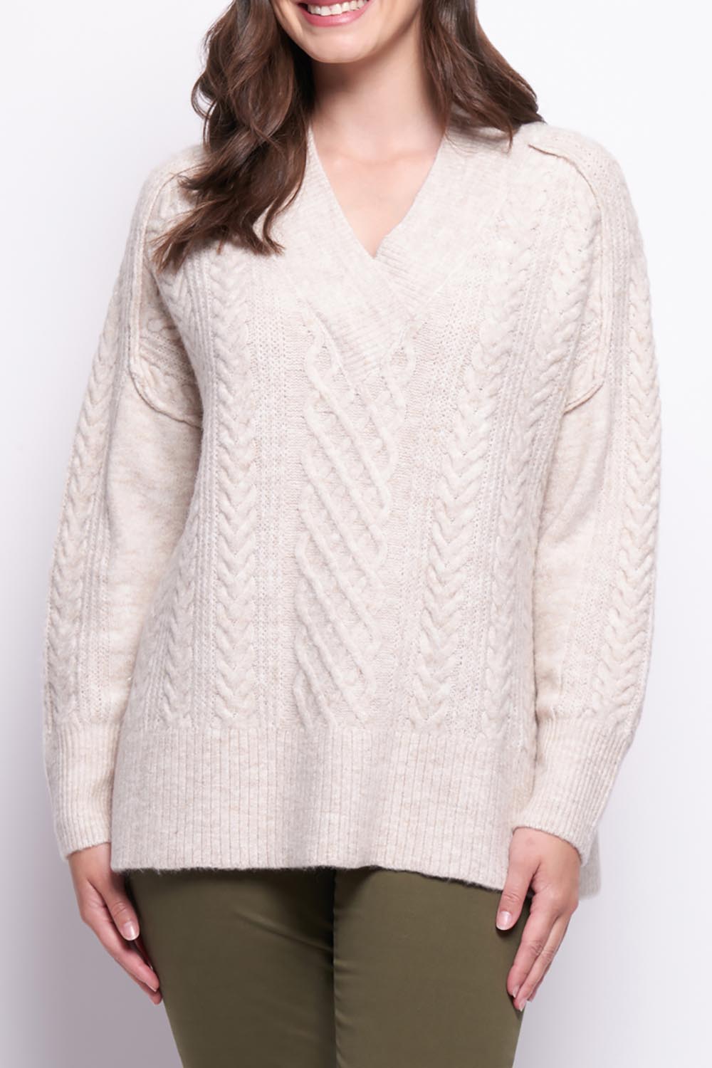 A model wearing the She's A Purla Sweater in colour Natural, from the front, cropped image
