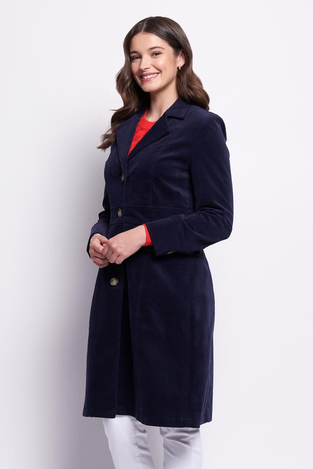 A model wearing the For The Rein colourCord Coat - Midnight (Blue), from the front, cropped image