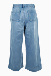 Product shot of the Jean Queen Crop in colour Bluewash (Blue), from the back