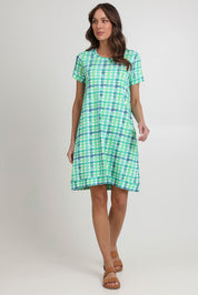 Model Madeline wearing size S of the Oh Frock Cotton Dress in colour Edgy (Green), from the front, showing the whole outfit