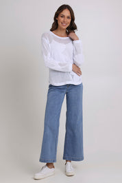 Model Madeline wearing size S of the Make My Daisy Cotton Sweater in colour White (White), from the front, showing the whole outfit