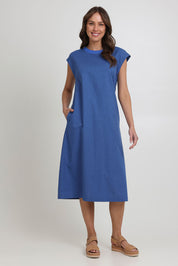 Model Madeline wearing size 10 of the Cut Of Your Rib Dress in colour Savoyblue (Blue), from the front, showing the whole outfit