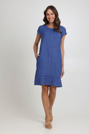 Model Madeline wearing size 10 of the Crowd Pleaser Linen Dress in colour Capri (Blue), from the front, showing the whole outfit