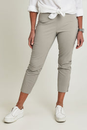 Model Sandy wearing size 10 of the Fuss Free 7/8 Pant in colour Lightkhaki (Green), from the front, cropped image