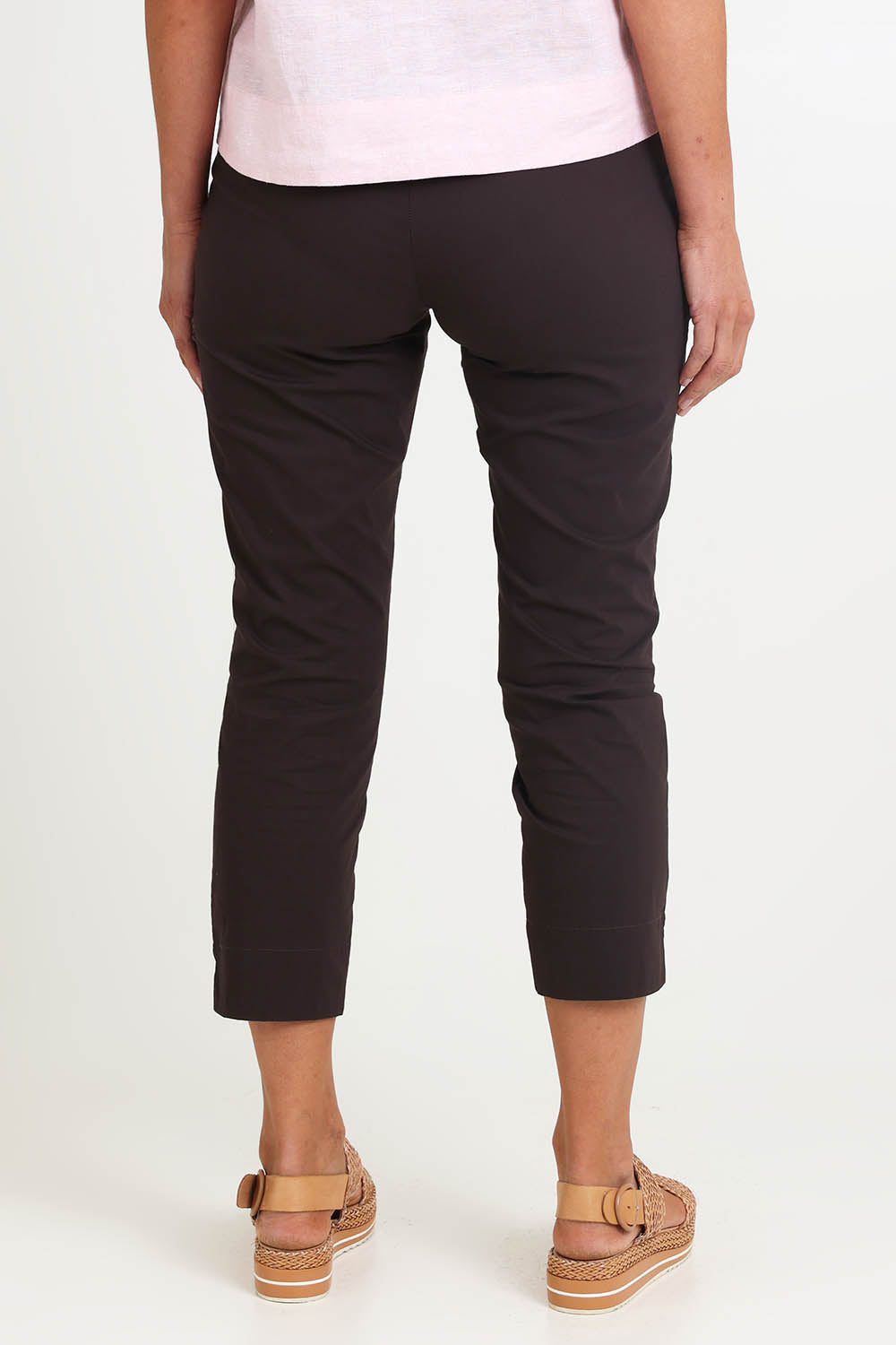 Model Riinar wearing size 10 of the Fuss Free 7/8 Pant – Sable in colour Sable, from the back