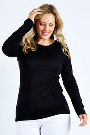 Model Jess wearing size L of the Merino Signature Crew Top in colour Black (Black), from the front, cropped image