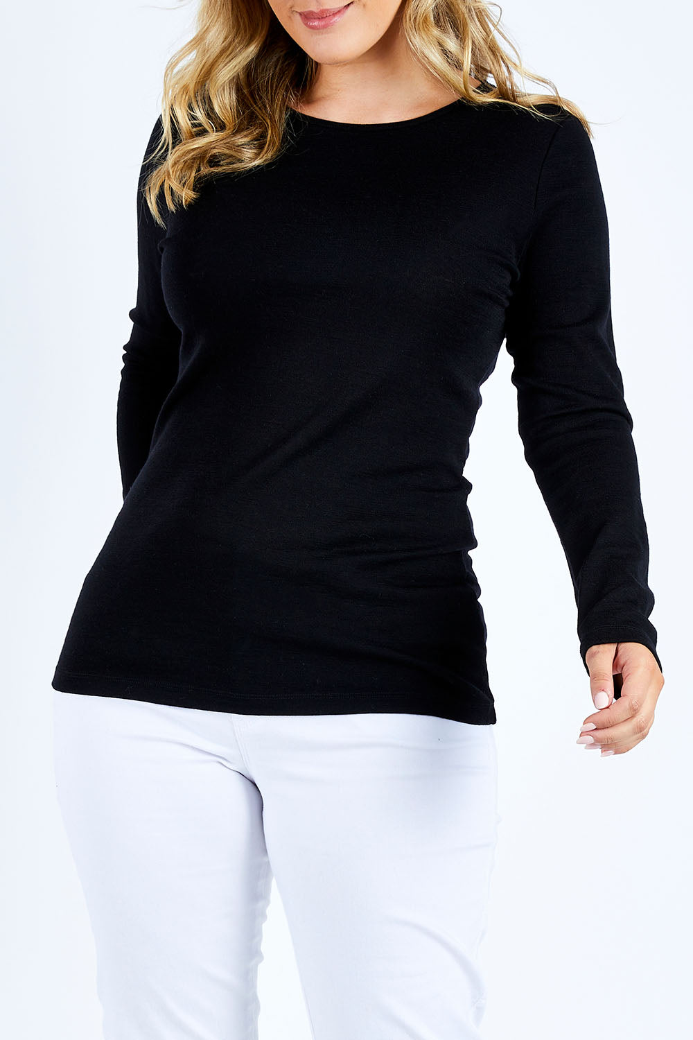 Model Jess wearing size L of the Merino Signature Crew Top in colour Black (Black), from the front, cropped image