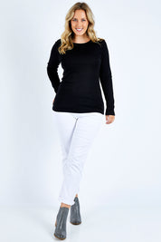 Model Jess wearing size L of the Merino Signature Crew Top in colour Black (Black), from the front, showing the whole outfit