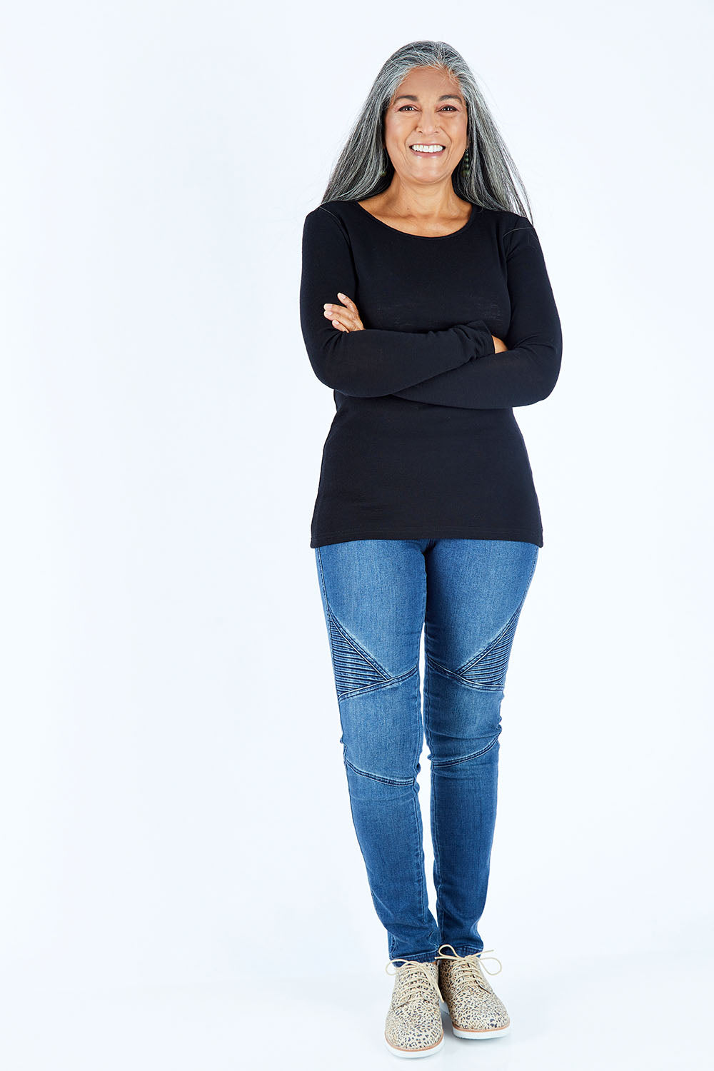 Model Nadine wearing size S of the Merino Signature Crew Top in colour Black (Black), from the front, showing the whole outfit