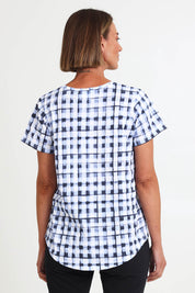 Model Riinar wearing size 10 of the Here Comes Summer Tee – Checkers in colour Checkers, from the back