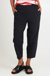 Model Riinar wearing size 10 of the Pump It Up Pant – Black in colour Black, in a cropped view