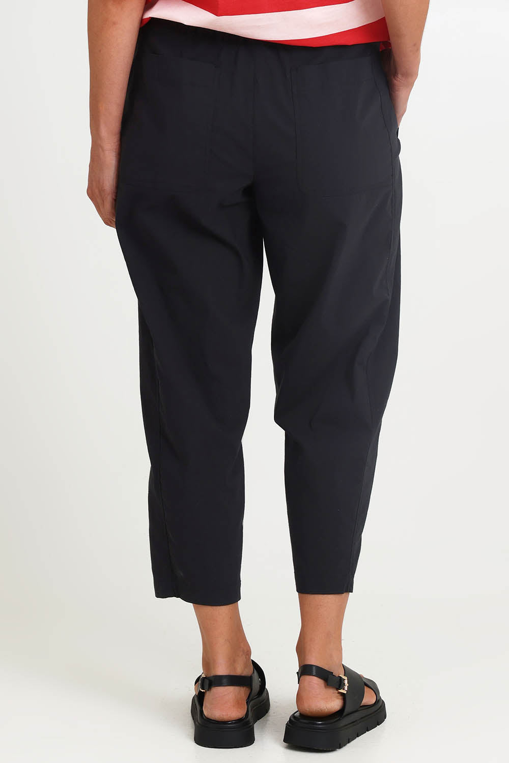 Model Riinar wearing size 10 of the Pump It Up Pant – Black in colour Black, from the front