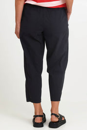 Model Riinar wearing size 10 of the Pump It Up Pant – Black in colour Black, from the front