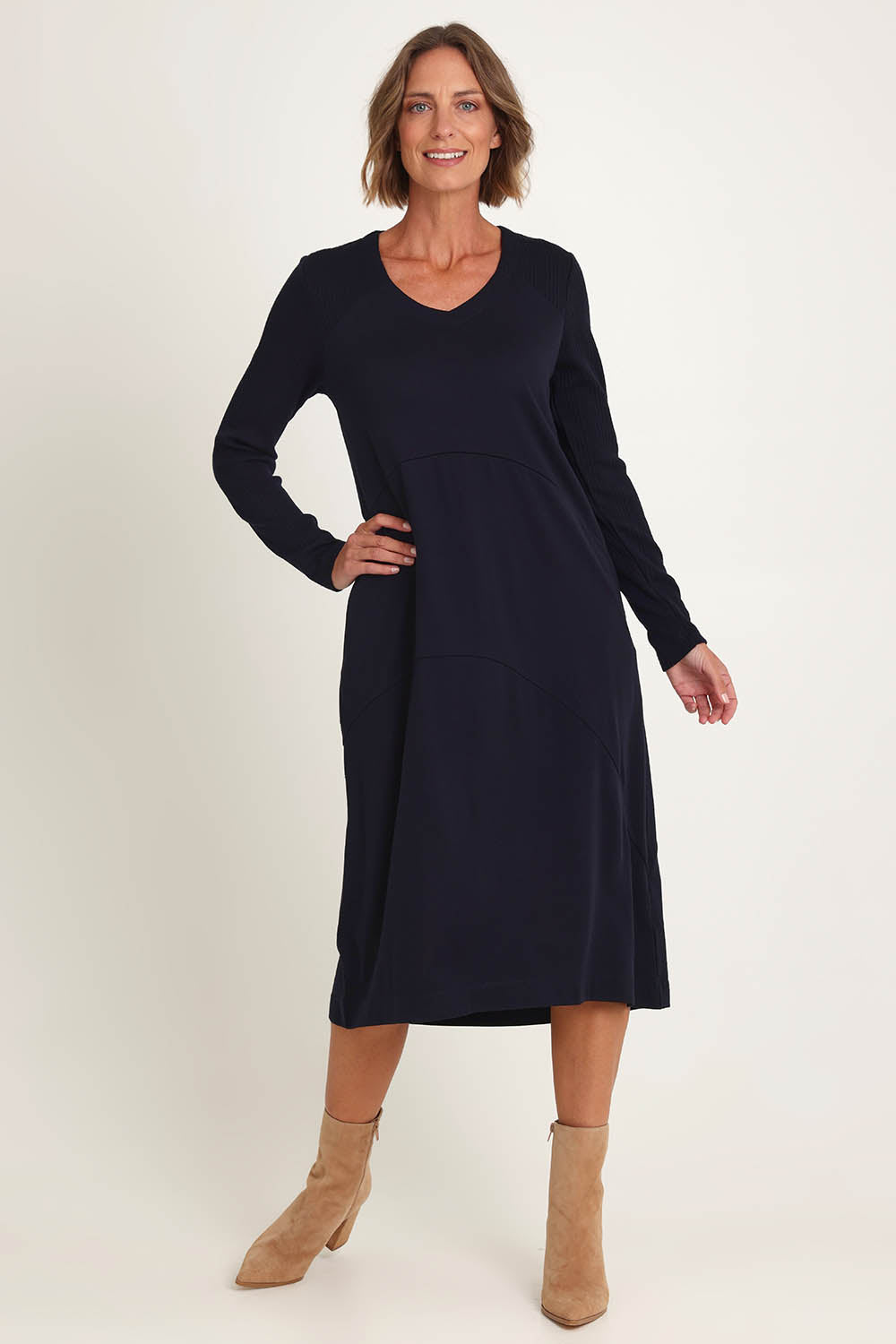 Model Riina wearing size S of the Upper Cut Dress in colour Nightsky (Blue), from the front, showing the whole outfit