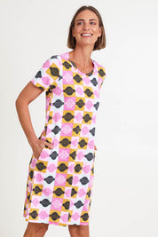 Model Riinar wearing size 10 of the Oh Frock Dress – Rhythm in colour Rhythm, from an angle