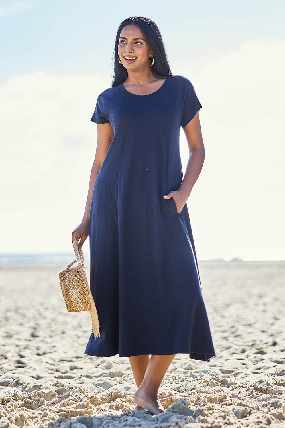 Model Eshan wearing size 10 of the Seamingly Good Dress – Truenavy in colour Truenavy, from the front
